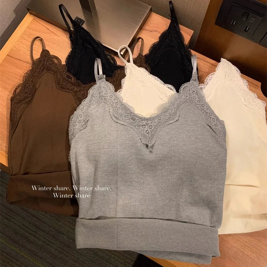 Four lace-trimmed Womens Crop Top Korean Version camisoles in brown, gray, white, and black are neatly folded on a wooden surface. The gray top displays the text Winter share. Winter share. Winter share.