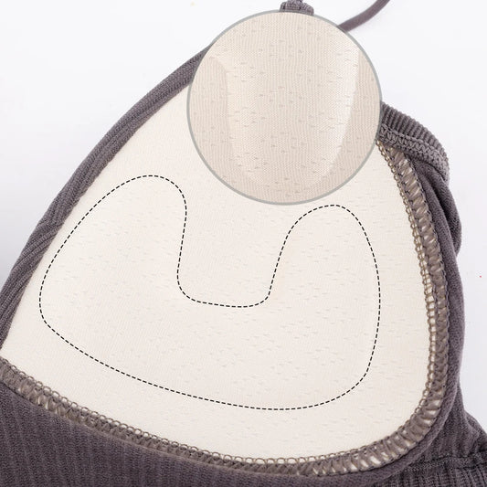 Close-up of the inside of a Womens Sexy Halter Crop Top in gray, showing lining and stitching details; a circular magnified inset highlights the breathable nylon fabric inspired by European styling.